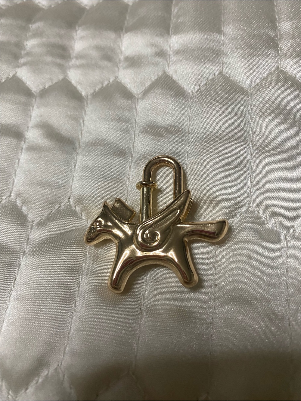 Cadena Gold tone Pegasus horse motif bag charm lock
